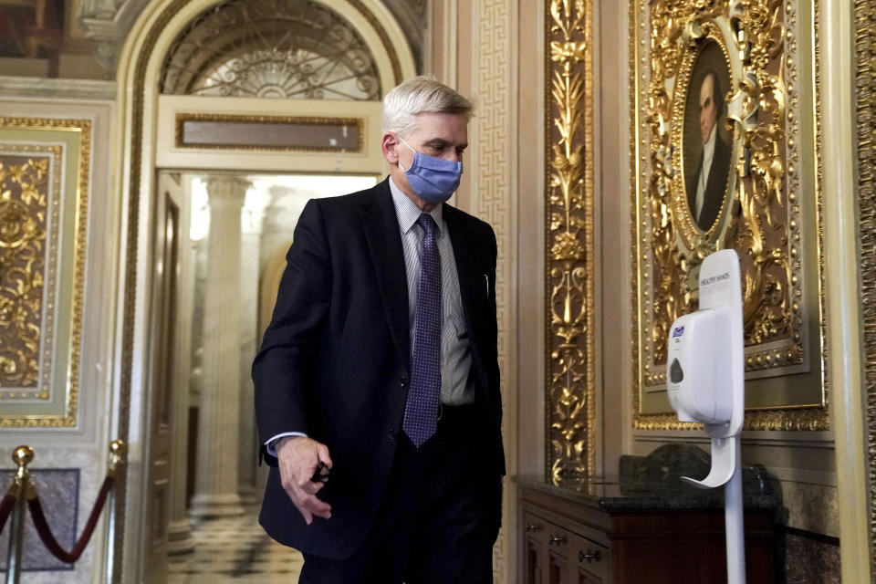 Sen. Bill Cassidy, R-La., walks on Capitol Hill after the Senate acquitted former President Donald Trump in his second impeachment trial in the Senate at the U.S. Capitol in Washington, Saturday, Feb. 13, 2021. Trump was accused of inciting the Jan. 6 attack on the U.S. Capitol, and the acquittal gives him a historic second victory in the court of impeachment. (Greg Nash/Pool via AP)