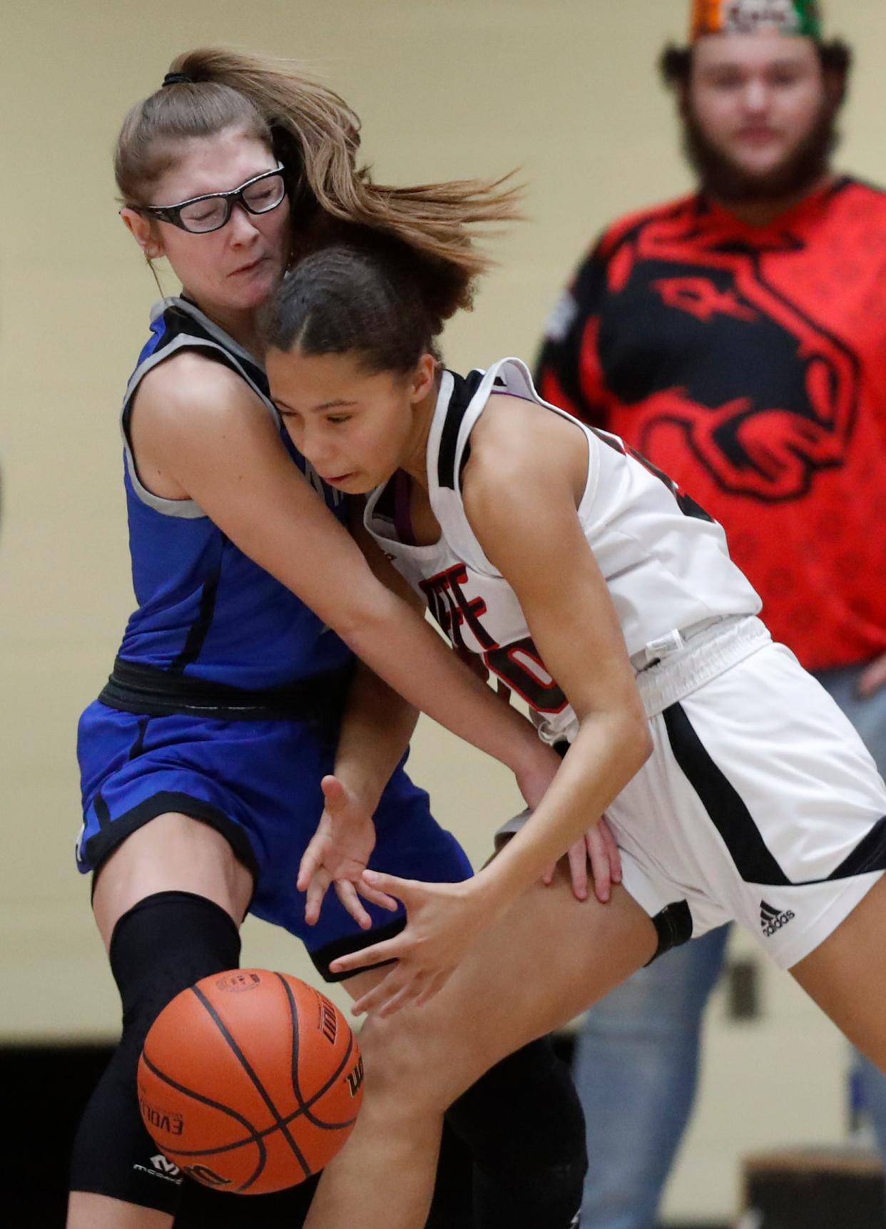 Carroll Cougars guard Alli Harness (2) defends Lafayette Jeff Bronchos guard Shaylee Barrett (20) during the IHSAA girl’s basketball game, Thursday, Jan. 26, 2023, at Lafayette Jeff High School in Lafayette, Ind. 