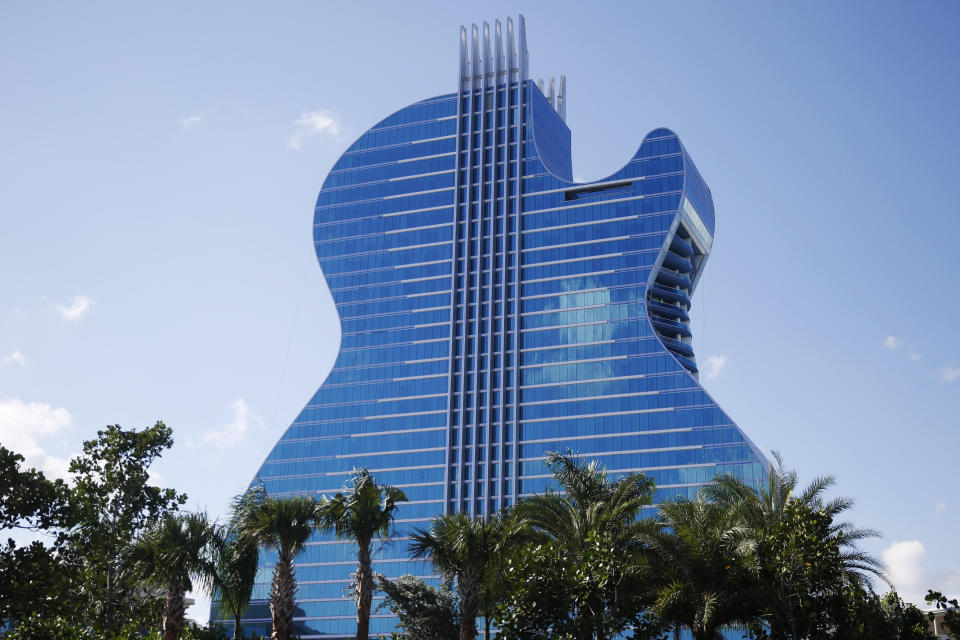 The guitar shaped hotel is seen at the Seminole Hard Rock Hotel and Casino on Thursday, Oct. 24, 2019, in Hollywood, Fla. The Guitar Hotel's grand opening is on the tribe's land in Hollywood. It's the latest step in the Seminole Hard Rock empire, which includes naming rights on the Miami-area stadium where the 2020 Super Bowl will be played. (AP Photo/Brynn Anderson)