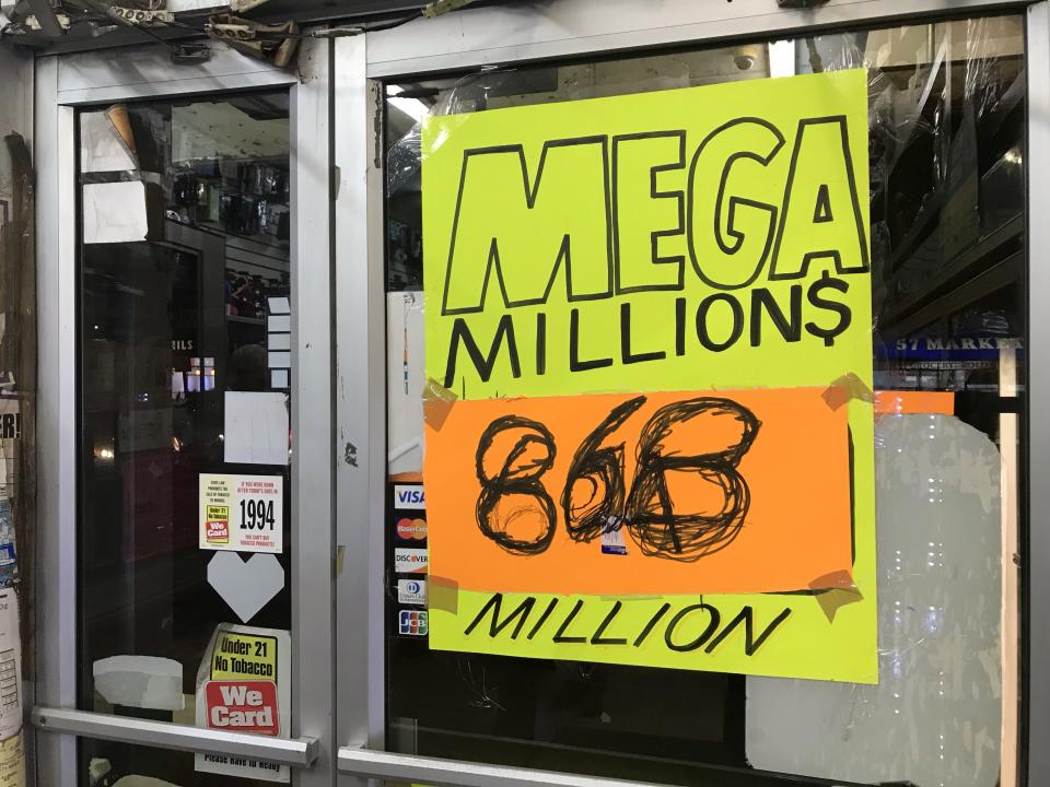 Manhattan Tobacco shop advertises lottery ticket sales Thursday, Oct. 18, 2018 in New York City