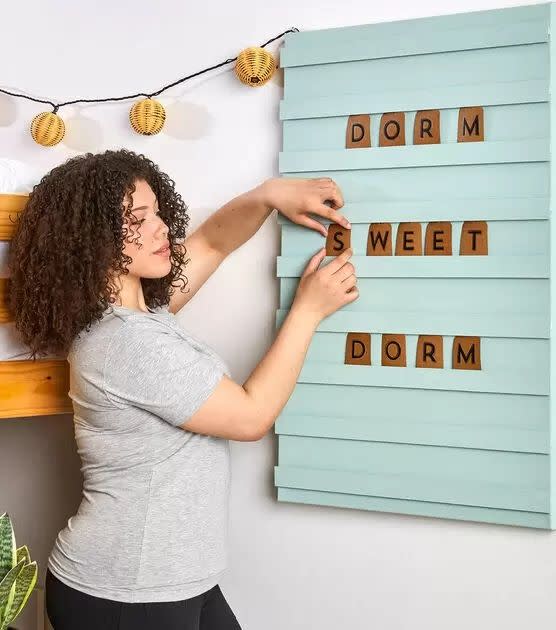 <p>Letter boards always come in handy for those special milestone photos, but they all start to look the same. Give yours personality by making a DIY slatted board in a color that matches your room.</p><p><a href="https://go.redirectingat.com?id=74968X1596630&url=https%3A%2F%2Fwww.joann.com%2Fcotton-lanyard%2F0922188784P127.html&sref=https%3A%2F%2Fwww.goodhousekeeping.com%2Fhome%2Fcraft-ideas%2Fg22593259%2Fback-to-school-diy%2F" rel="nofollow noopener" target="_blank" data-ylk="slk:Get the tutorial at JOANN »;elm:context_link;itc:0;sec:content-canvas" class="link "><em>Get the tutorial at JOANN » </em></a></p>