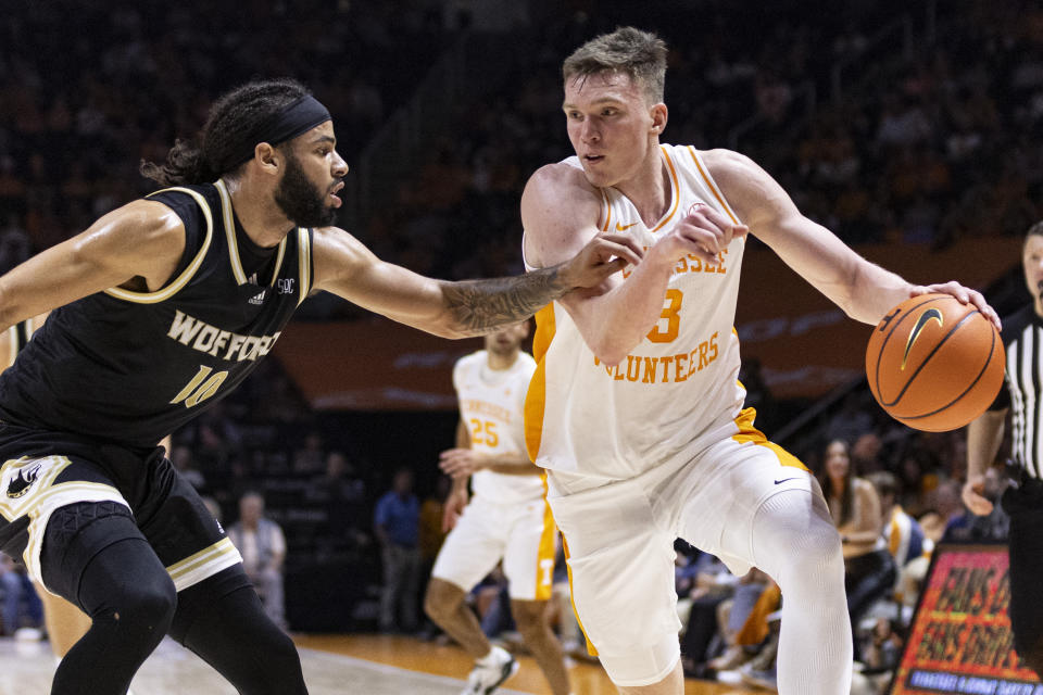 Tennessee guard Dalton Knecht (3) drives against Wofford guard Corey Tripp (10) during the second half of an NCAA college basketball game Tuesday, Nov. 14, 2023, in Knoxville, Tenn. (AP Photo/Wade Payne)