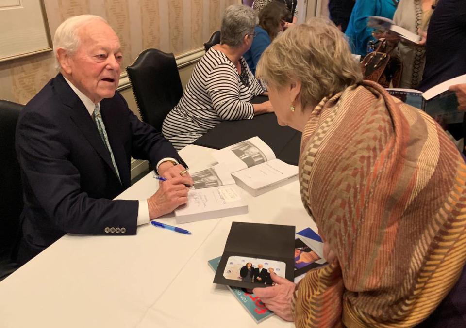 Bob Scieffer signs copies of his new book for guests at a Meals on Wheels Inc. of Tarrant County fundraising event in 2019.