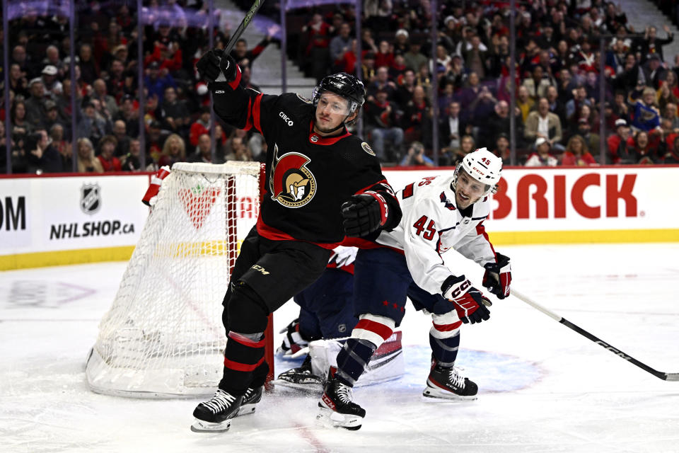 Ottawa Senators right wing Vladimir Tarasenko, left, celebrates his goal on Washington Capitals goaltender Darcy Kuemper, behind, as Capitals center Matthew Phillips (45) looks on during first period of an NHL hockey game in Ottawa, Ontario, on Wednesday, Oct. 18, 2023. (Justin Tang/The Canadian Press via AP)