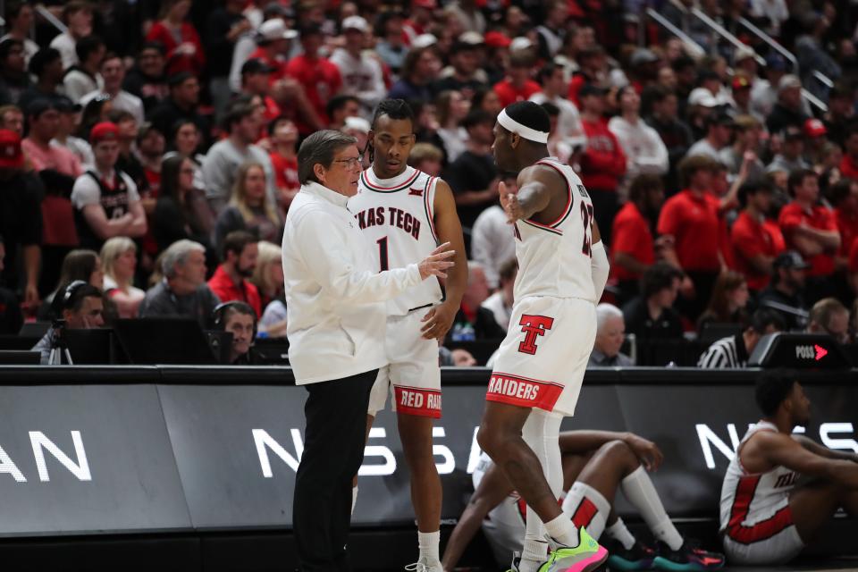 Feb 25, 2023; Lubbock, Texas, USA; Texas Tech Red Raiders head coach Mark Adams gives instructions to guard Lamar Washington (1) and guard De’vion Harmon (23) in the first half against the TCU Horned Frogs at United Supermarkets Arena. Mandatory Credit: Michael C. Johnson-USA TODAY Sports ORG XMIT: IMAGN-513584 ORIG FILE ID:  20230225_anw_aj7_0328.JPG