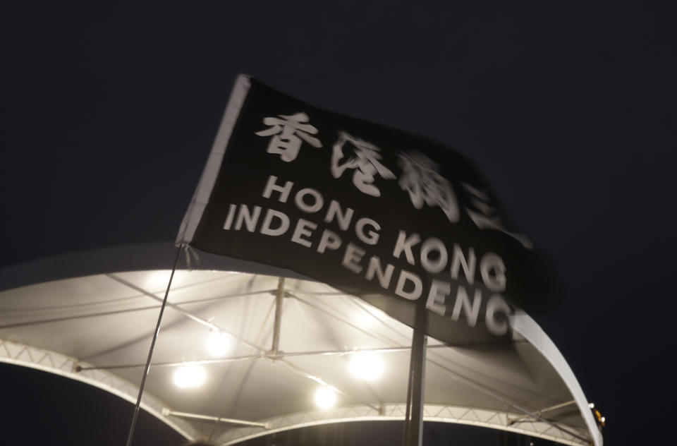 A flag flutters with a slogan reading ''Hong Kong Independence'' during a candlelight vigil at Democracy Square in Taipei, Taiwan, Tuesday, June 4, 2024, to mark the 35th anniversary of the Chinese military crackdown on the pro-democracy movement in Beijing's Tiananmen Square. (AP Photo/Chiang Ying-ying)
