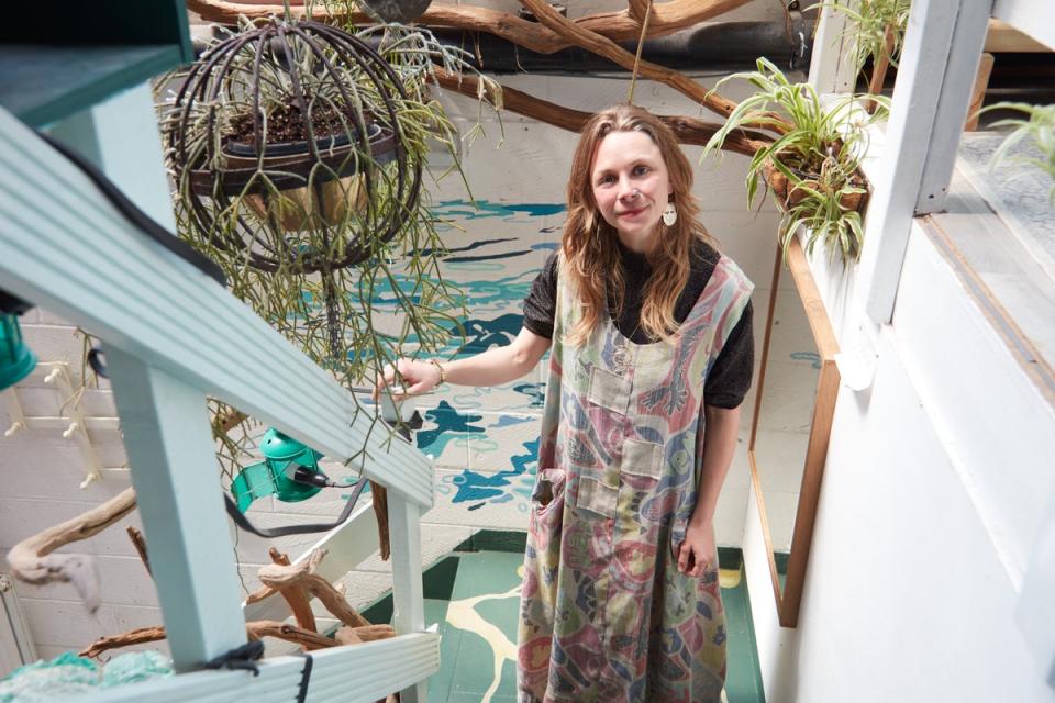 Resident Caitlin Strongarm, an artist, moved into her warehouse home in 2021 and works from the space (Juliet Murphy)