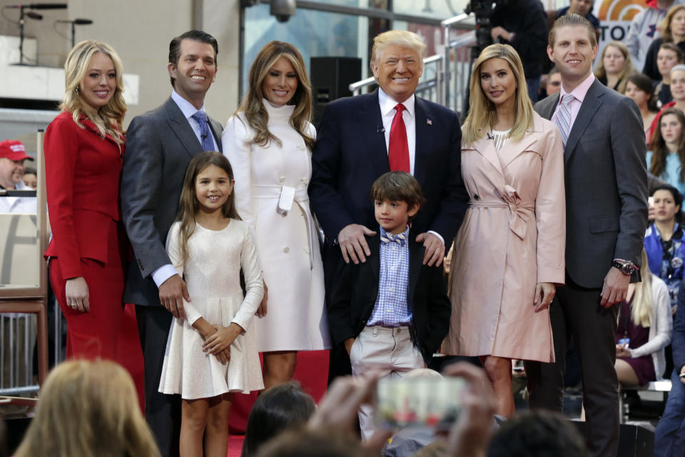 Then Republican presidential candidate Donald Trump, fourth from left, poses for a photo with family members on the NBC "Today" television program, in New York, Thursday, April 21, 2016. From left are: daughter Tiffany Trump, son Donald Trump Jr., his wife Melania Trump, daughter Ivanka Trump, and son Eric Trump. Standing In the front row are Kai Trump and Donald Trump III, children of Donald Trump Jr. (Richard Drew/AP)