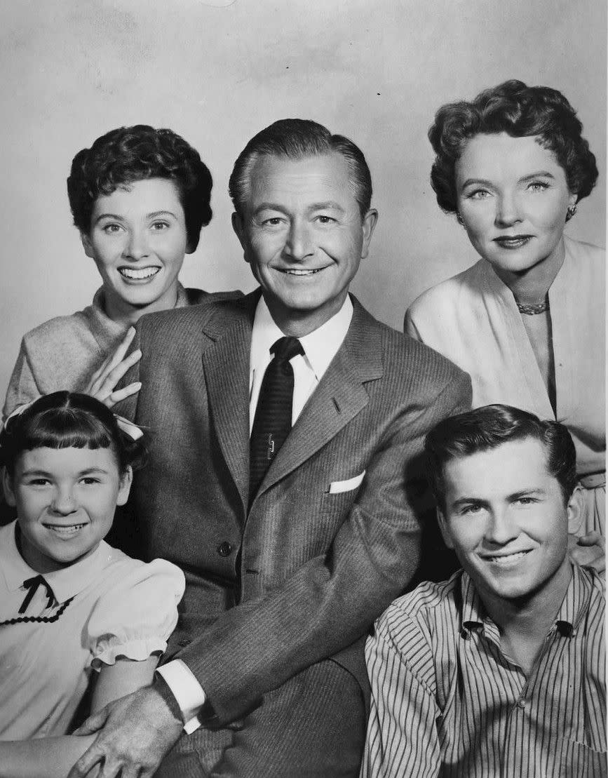 Cast photo of the Anderson family from the television program Father Knows Best. Top row, from left: Elinor Donahue, Robert Young, Jane Wyatt. Bottom row, from left: Lauren Chapin, Billy Gray.
