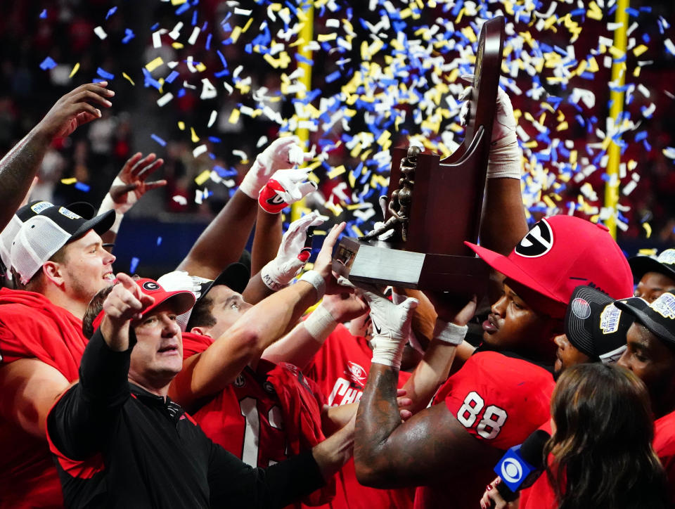 Dec. 3, 2022; Atlanta; Georgia Bulldogs head coach Kirby Smart and the Georgia Bulldogs celebrate after their 50-30 victory over the LSU Tigers in the SEC Championship game at Mercedes-Benz Stadium. John David Mercer-USA TODAY Sports