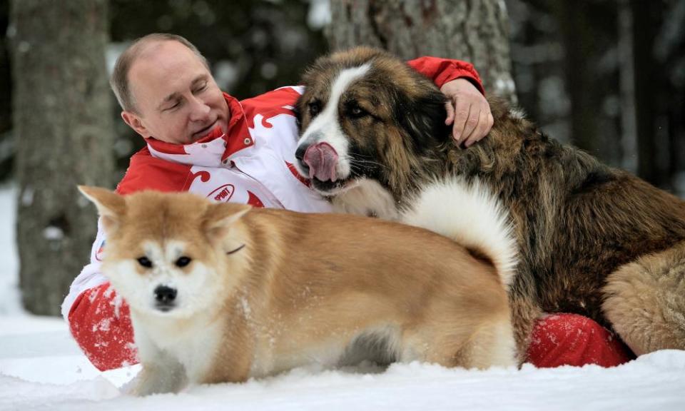 Vladimir Putin plays with his dogs Buffy and Yume at his residence Novo-Ogariovo, outside Moscow.