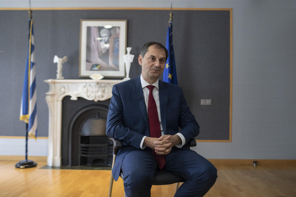 Greek Minister of Tourism, Harry Theoharis speaks during an interview with the Associated Press at his office in Athens, Tuesday, June 2, 2020. Greece is ready to welcome tourists from all over the world this summer _ but the country will be adhering to the advice of health experts to ensure it remains a safe destination in terms of the risk of coronavirus spread, the country's tourism minister said Tuesday. (AP Photo/Petros Giannakouris)