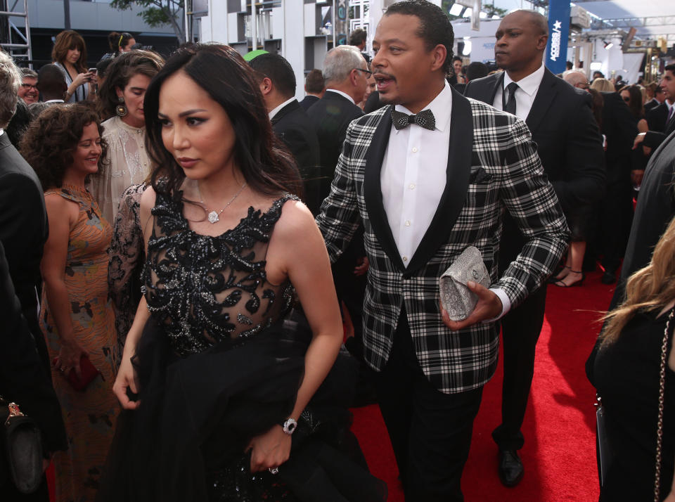 Mira Pak , left, and Terrence Howard arrive at the 68th Primetime Emmy Awards on Sunday, Sept. 18, 2016, at the Microsoft Theater in Los Angeles. (Photo by Matt Sayles/Invision for the Television Academy/AP Images)