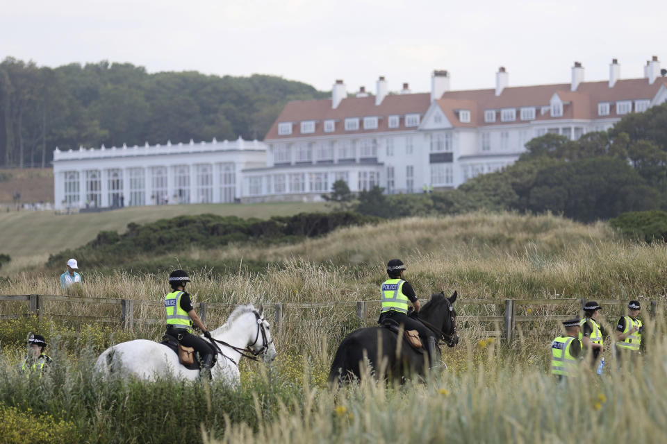 FILE - Police patrol near the Trump Turnberry golf resort, in Turnberry, Scotland, Saturday, July 14, 2018. Within days, Donald Trump could potentially have his sprawling real estate business empire ordered “dissolved” for repeated misrepresentations on financial statements to lenders, adding him to a short list of scam marketers, con artists and others who have been hit with the ultimate punishment for violating New York’s powerful anti-fraud law. An Associated Press analysis of nearly 70 years of civil cases under the law showed that such a penalty has only been imposed a dozen previous times. (AP Photo/Peter Morrison, File)