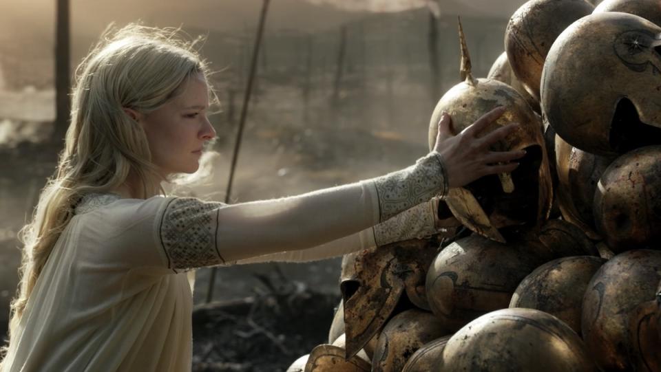 Galadriel places a helmet in a pyramid of them 