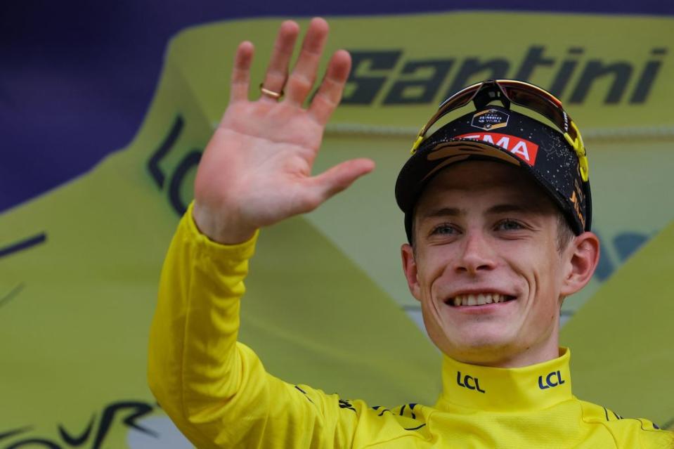 JumboVismas Danish rider Jonas Vingegaard celebrates on the podium with the overall leaders yellow jersey after the 8th stage of the 110th edition of the Tour de France cycling race 201 km between Libourne and Limoges in central western France on July 8 2023 Photo by Thomas SAMSON  AFP Photo by THOMAS SAMSONAFP via Getty Images