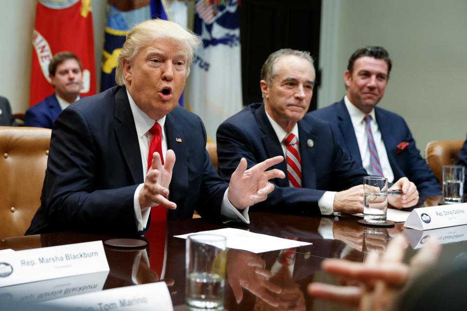 President Donald Trump in 2017, accompanied by U.S. Rep. Chris Collins R-New York, speaks in the White House. Trump pardoned Collins on Dec. 22, 2020, after former congressman began serving a 26-month sentence at Federal Prison Camp, Pensacola on Oct. 13, 2020. Collins, who had pleaded guilty to insider trading and lying to federal law enforcement agents, worked on Trump's White House transition team after the 2016 election.