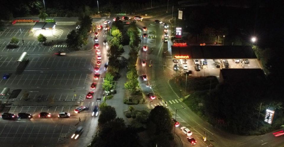 Motorists queue to fill their cars at a Sainsbury’s fuel station in Ashford, Kent (Gareth Fuller/PA) (PA Wire)