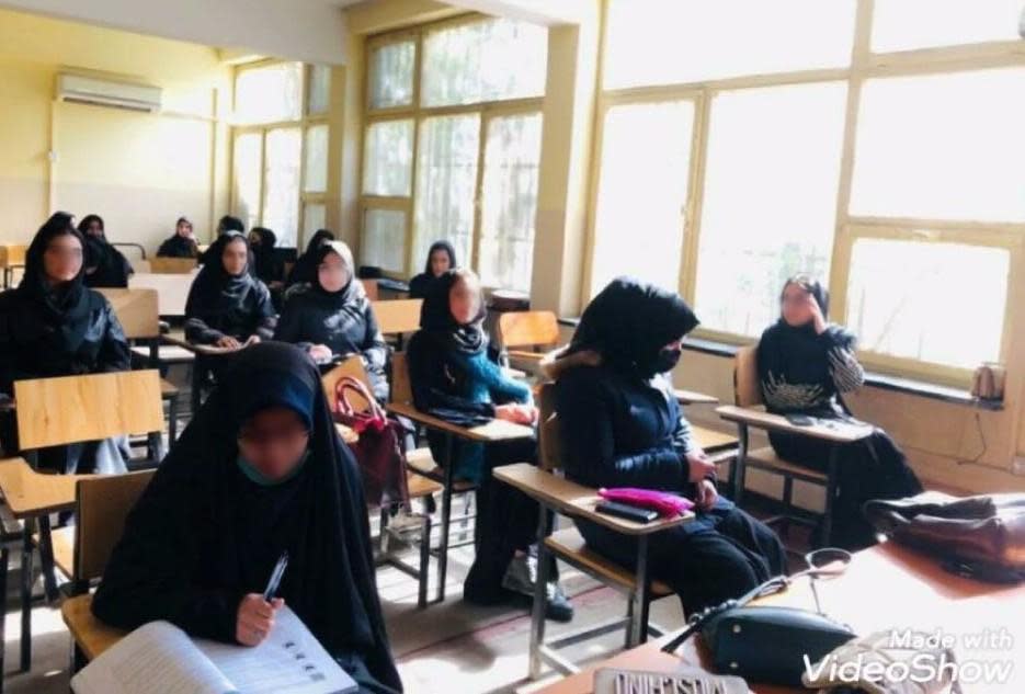 Maryam, far left, sits in a class at Kabul University with other students - all women, all wearing the hijab - prior to the Taliban regime barring women from universities across Afghanistan in December 2022.  / Credit: Handout