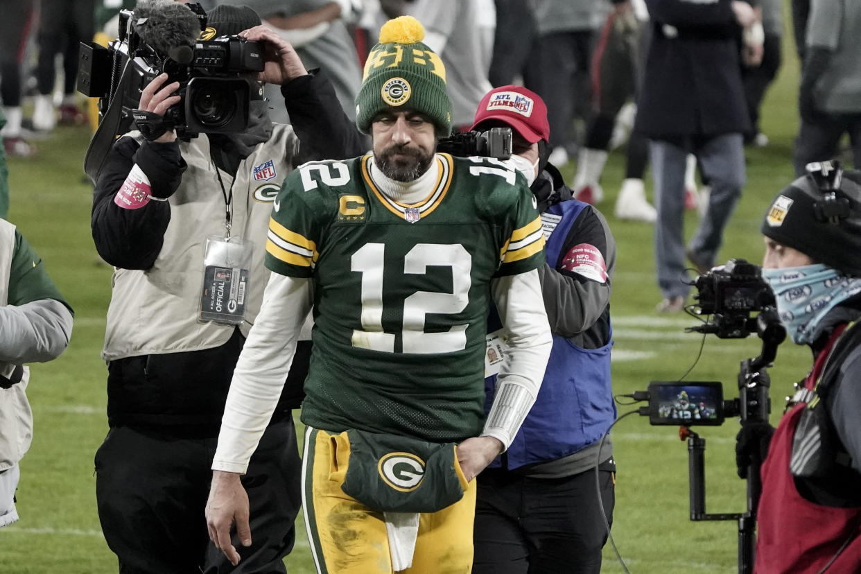 Green Bay Packers quarterback Aaron Rodgers (12) walks off the field after the NFC championship NFL football game against the Tampa Bay Buccaneers in Green Bay, Wis., Sunday, Jan. 24, 2021. The Buccaneers defeated the Packers 31-26 to advance to the Super Bowl. (AP Photo/Morry Gash)