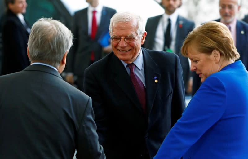 German Chancellor Angela Merkel and United Nations Secretary-General Antonio Guterres welcome European Union's Foreign Policy Chief Josep Borrell at the Libya summit in Berlin