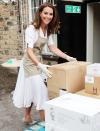 <p>Kate Middleton helps unload supplies during a <a href="https://people.com/royals/kate-middleton-visits-baby-bank/" rel="nofollow noopener" target="_blank" data-ylk="slk:visit to Baby Basics;elm:context_link;itc:0;sec:content-canvas" class="link ">visit to Baby Basics</a>, a charity that acts as a food bank for baby supplies, in Sheffield, England, on Tuesday. </p>