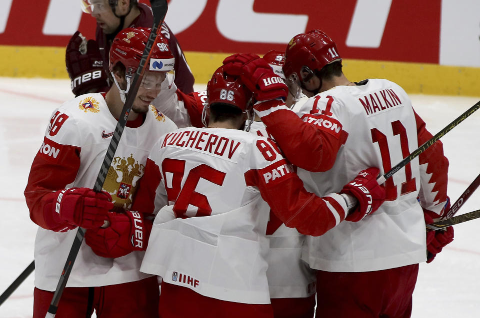 Russia's players react after scoring during the Ice Hockey World Championships group B match between Latvia and Russia at the Ondrej Nepela Arena in Bratislava, Slovakia, Saturday, May 18, 2019. (AP Photo/Ronald Zak)