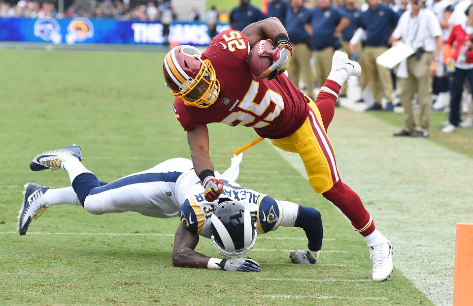 <p>Washington Redskins running back Chris Thompson (25) is upended by Los Angeles Rams strong safety Maurice Alexander (31) as he flies past the goal marker for a touchdown in the second quarter of the game at the Los Angeles Memorial Coliseum. Mandatory Credit: Jayne Kamin-Oncea-USA TODAY Sports </p>