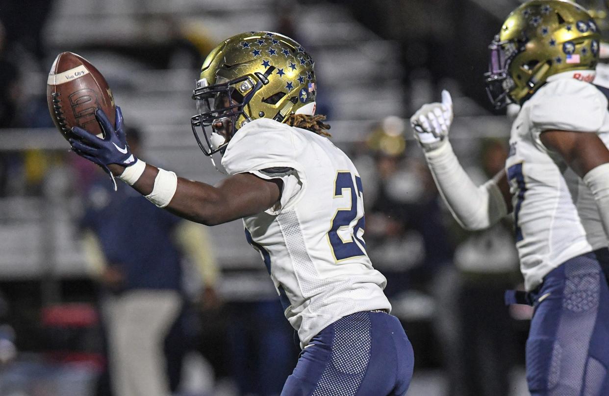 Spartanburg's Cam Smith (22) recovers a fumble against TL Hanna during the second quarter of the Class AAA State Playoffs at TL Hanna High in Anderson, S.C. Friday, November 11, 2022.