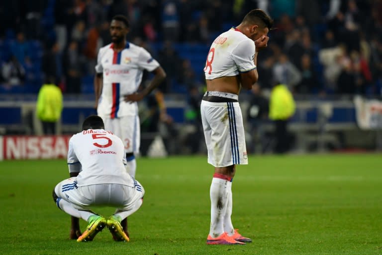 Lyon's Mouctar Diakhaby (L) and Corentin Tolisso (R) react at the end of their Champions League football match against Juventus on October 18, 2016 in Decines-Charpieu near Lyon, southeastern France