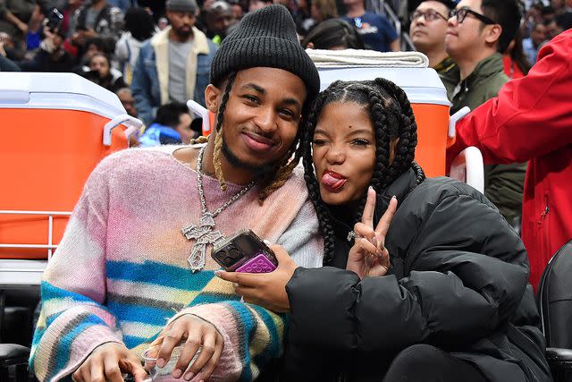 <p>Allen Berezovsky/Getty</p> DDG and Halle Bailey attend a basketball game between the Los Angeles Clippers and the Golden State Warriors at Crypto.com Arena in December 2023 in Los Angeles