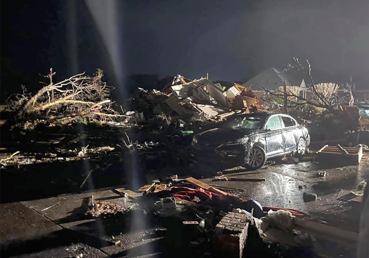 A damaged vehicle sits among debris after a deadly tornado tore through Brunswick County, N.C., Tuesday, Feb. 16, 2021.