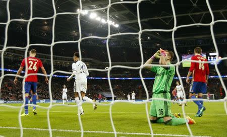 Football Soccer Britain - Tottenham Hotspur v CSKA Moscow - UEFA Champions League Group Stage - Group E - Wembley Stadium, London, England - 7/12/16 CSKA Moscow's Igor Akinfeev looks dejected after scoring a own goal and the third for Tottenham as Tottenham's Dele Alli celebrates Action Images via Reuters / John Sibley Livepic