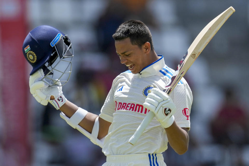 India's Yashasvi Jaiswal celebrates after he scored a century against West Indies on day two of their first cricket Test match at Windsor Park in Roseau, Dominica, Thursday, July 13, 2023. (AP Photo/Ricardo Mazalan)