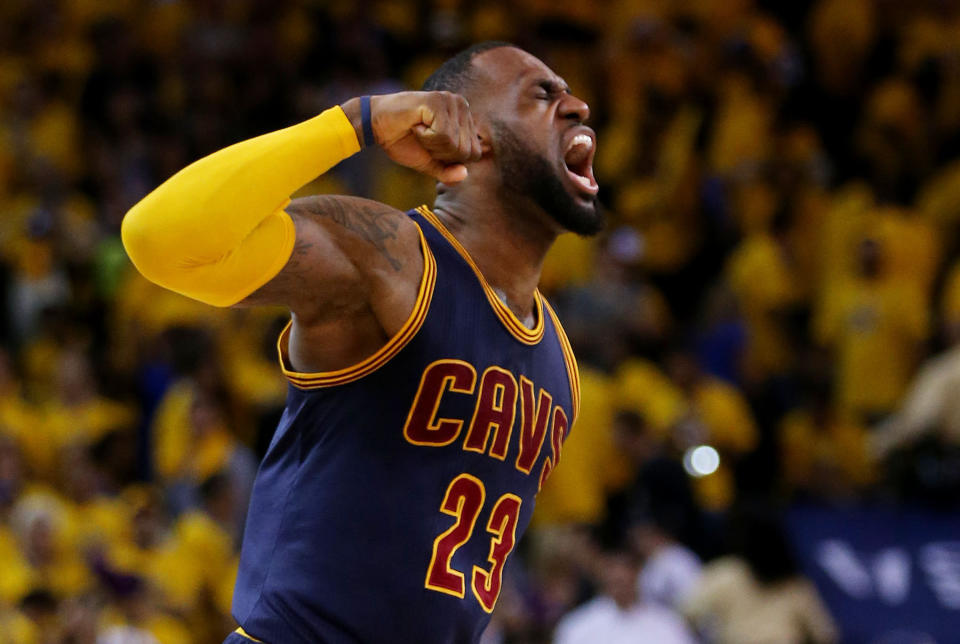 OAKLAND, CA - JUNE 07:  LeBron James #23 of the Cleveland Cavaliers celebrates their 95 to 93 win over the Golden State Warriors in overtime  during Game Two of the 2015 NBA Finals at ORACLE Arena on June 7, 2015 in Oakland, California. NOTE TO USER: User expressly acknowledges and agrees that, by downloading and or using this photograph, user is consenting to the terms and conditions of Getty Images License Agreement.  (Photo by Ezra Shaw/Getty Images)