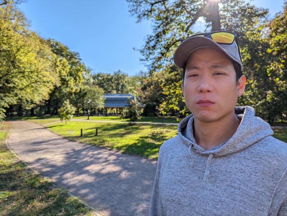 <p>Another Pixel 6 camera sample of a man in the park frowning at the camera with his face in focus. Google's Face Unblur tool combines pictures from the phone's cameras to keep your subject's faces sharp even if they were blurry.</p>
