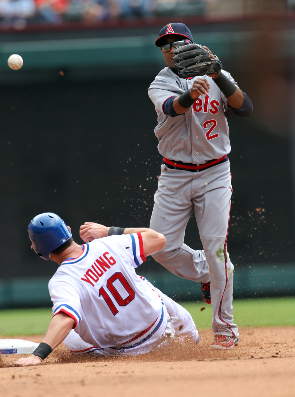 ARLINGTON, TX - MAY 12: Erick Aybar #2 of the Los Angeles Angels of Anaheim turns the double play as Michael Young #10 of the Texas Rangers is out at 2nd base on May 12, 2012 in Arlington, Texas. (Photo by Layne Murdoch/Getty Images)