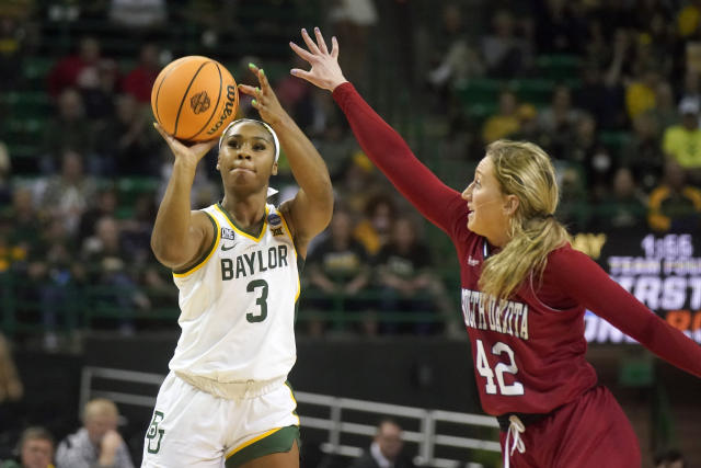 Baylor guard Jordan Lewis (3) shoots against South Dakota guard Maddie Krull (42) during the first half of a college basketball game in the second round of the NCAA tournament in Waco, Texas, Sunday, March 20, 2022. (AP Photo/LM Otero)