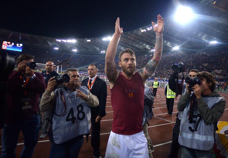 AS Roma's Daniele de Rossi celebrates at the end of an Italian Serie A match, at Olympic stadium in Rome, on October 18, 2013