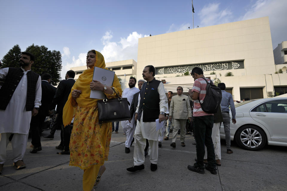 Lawmakers of the National Assembly arrive for a group photo with Pakistan's Prime Minister Shehbaz Sharif at the end of the last session of the current parliament, in Islamabad, Pakistan, Wednesday, Aug. 9, 2023. Pakistan's prime minister took a formal step Wednesday toward dissolving parliament, starting a possible countdown to a general election, as his chief political rival fought to overturn a corruption conviction that landed him in a high-security prison over the weekend. (AP Photo/Anjum Naveed)