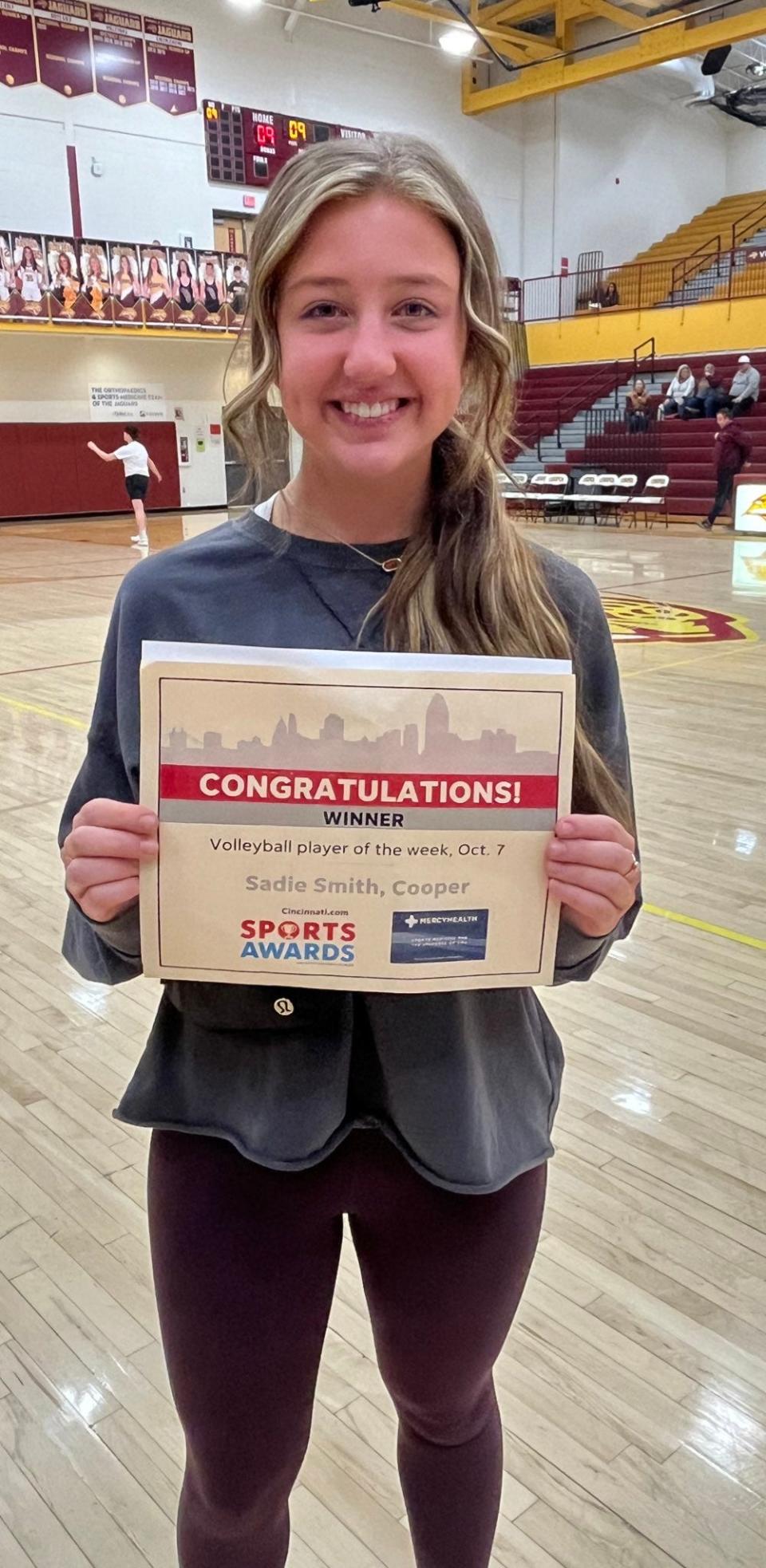 Sadie Smith of Cooper shares the certificate she earned as the cincinnati.com volleyball player of the week for Oct. 7.