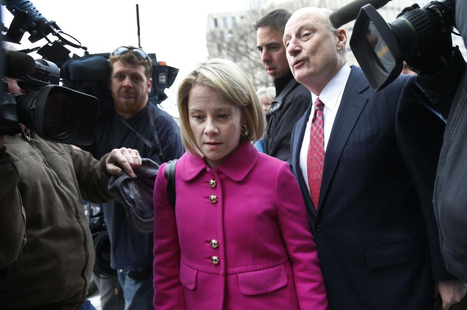 New Jersey Governor Chris Christie's former deputy chief of staff Bridget Anne Kelly makes her way through a crush of media with her attorney as she arrives at Mercer County Court in Trenton, New Jersey, March 11, 2014. A New Jersey Superior Court judge was scheduled to hear arguments Tuesday about whether Kelly and Christie's former campaign manager, Bill Stepien, have to turn over documents to a New Jersey state legislative committee investigating the September 2013 lane closures on the George Washington bridge. (REUTERS/Mike Segar)