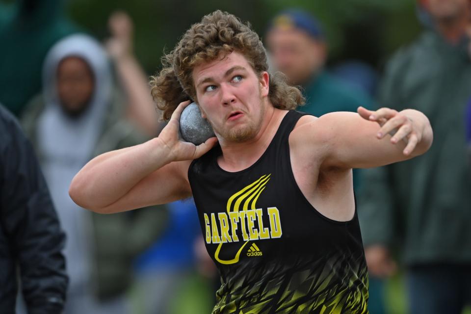 Garfield’s Riley LaPorte competes during the boys shot put Saturday during the Division II regional track meet at Austintown Fitch High School.