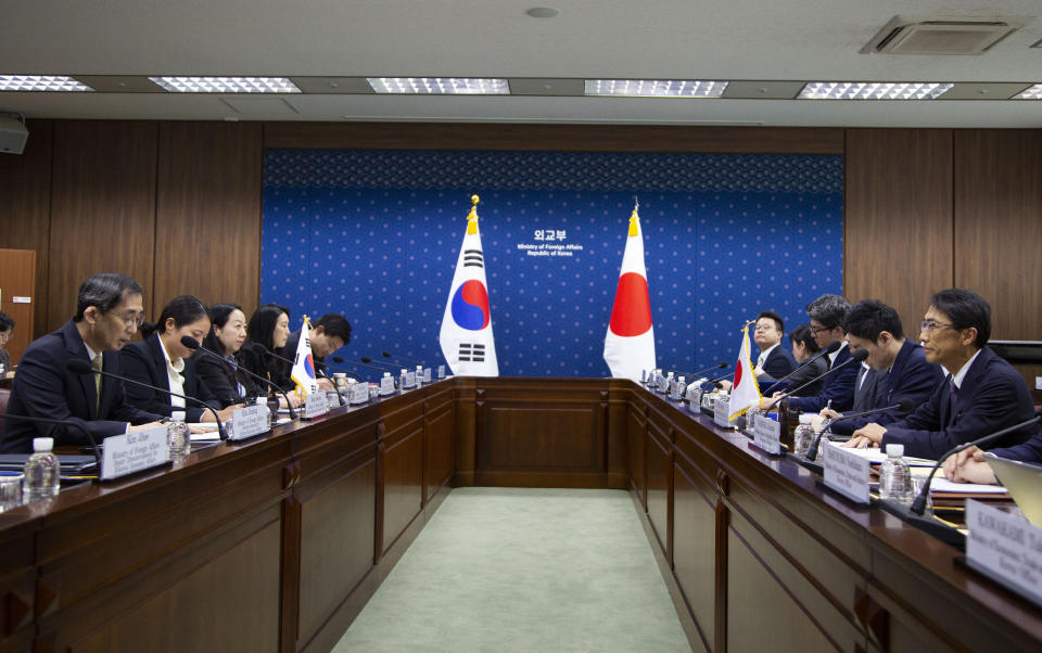 South Korean Kang Jae-kwon, left, Ministry of Foreign Affairs Deputy Minister for Economic Affairs, meets with Japanese counterpart Keiichi Ono, right, Senior Deputy Minister for Foreign Affairs prior their meeting at the ministry of foreign affairs in Seoul, South Korea. Thursday, Dec. 21, 2023. (Jeon Heon-Kyun/Pool Photo via AP)