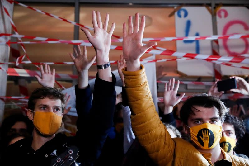 Students hold a news conference in front of the University of Theatre and Film Arts in Budapest