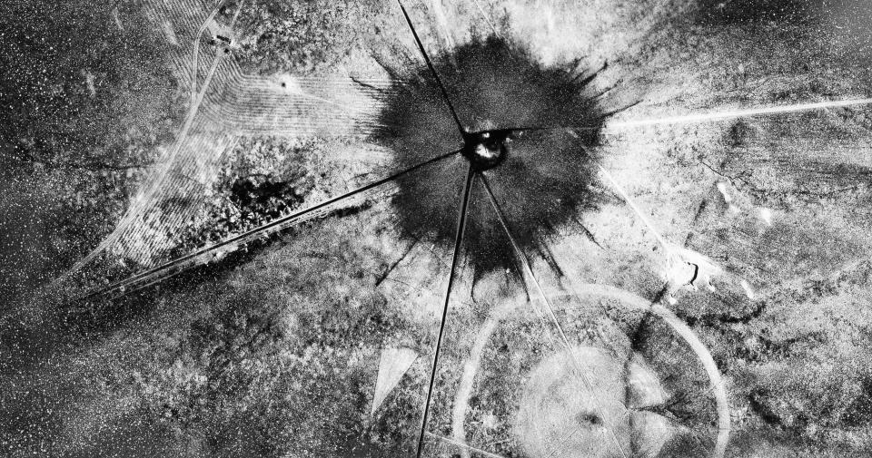 This photo shows an aerial view after the first atomic explosion at Trinity Test Site, in N.M., on July 16, 1945. A new film on J. Robert Oppenheimer's life and his role in the development of the atomic bomb as part of the Manhattan Project during World War II has brought new attention to a decades-long efforts to extend compensation for families who were exposed to fallout and still grapple with related illnesses.