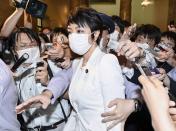 Japan's upper house lawmaker Anri Kawai is surrounded by reporters after plenary session in Tokyo