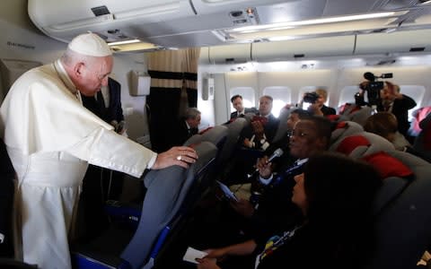 Pope Francis answered questions from journalists while travelling back from a trip to Africa - Credit: ALESSANDRA TARANTINO/&nbsp;AFP