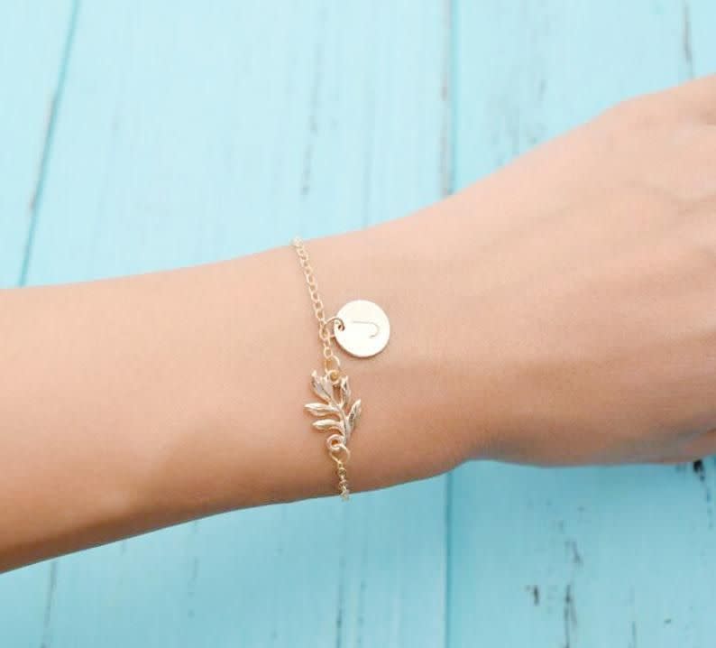 <p><strong>GuwaDesign</strong></p><p>etsy.com</p><p><strong>$2.98</strong></p><p>You can get away with scoring a cheap personalized present by finding something special with your friend's initial on it. This gold plated bracelet comes with a dainty leaf for a minimalist look.</p>