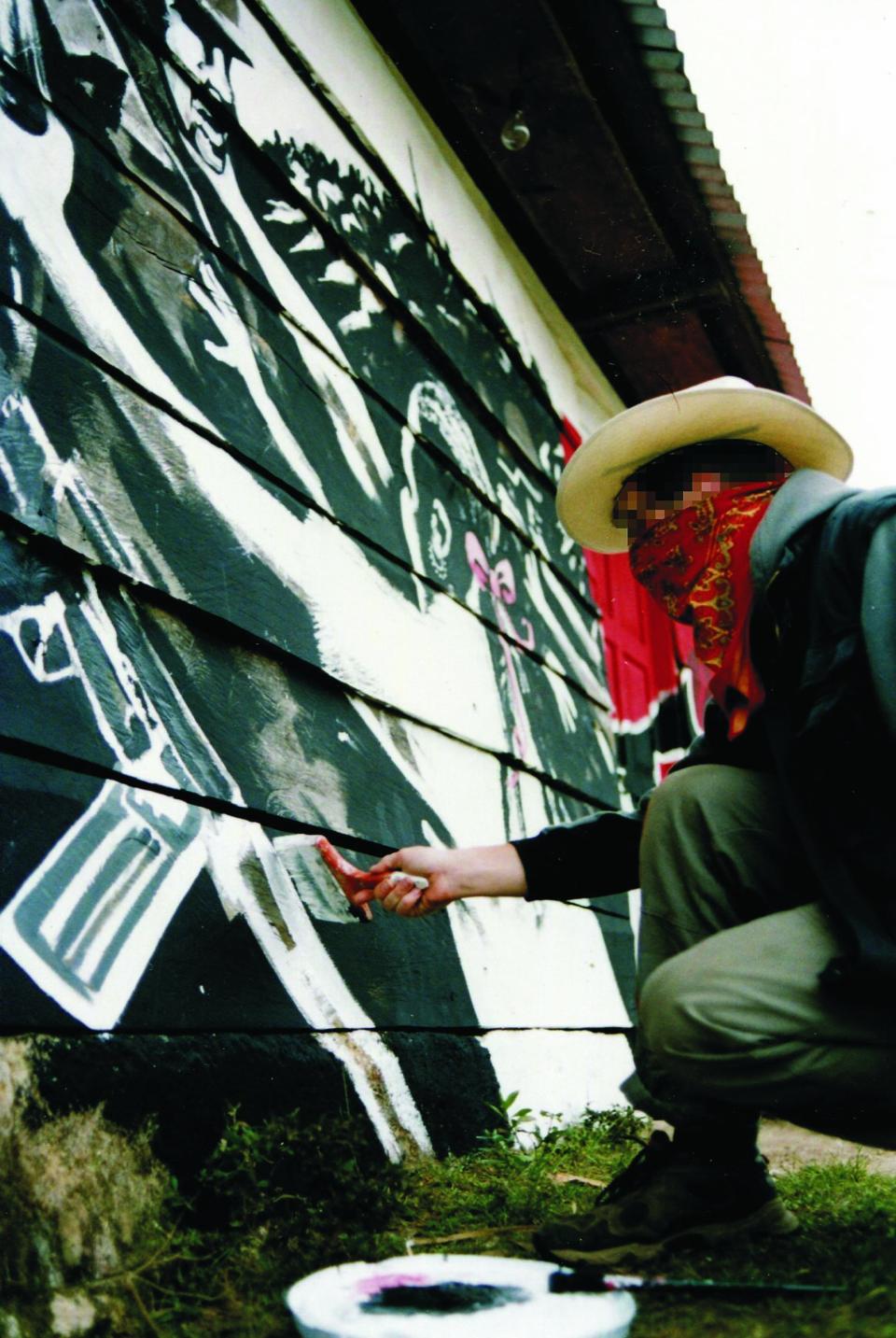 This is the first ever confirmed picture of secretive graffiti artist Banksy - taken when he was an amateur footballer on tour playing against freedom fighters.